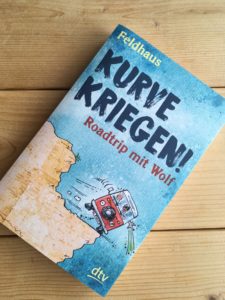 Read more about the article [Rezension] Kurve kriegen! – Roadtrip mit Wolf – Hans-Jürgen Feldhaus